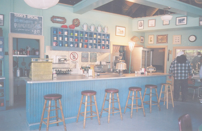 Inside of an older styled diner, vintage and decorated
